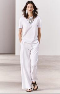 Basic white tee with statement necklace and maxi earrings in silver